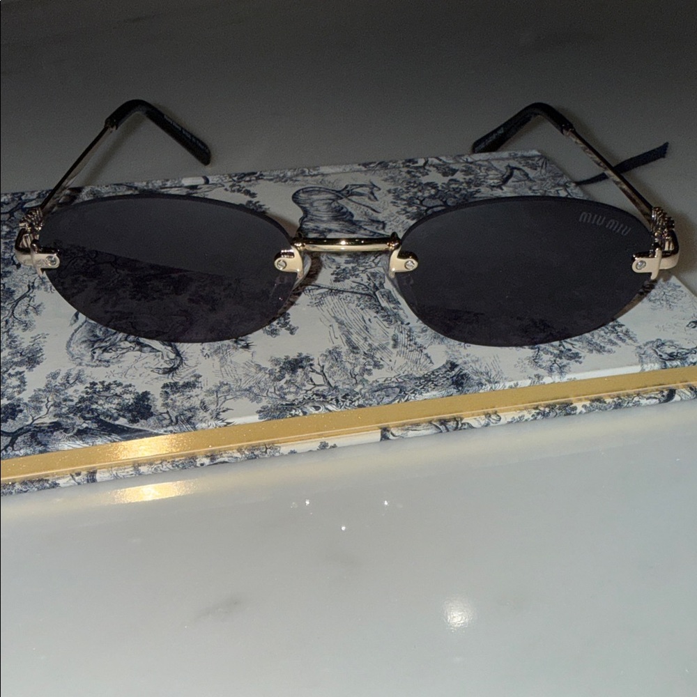 Miu Miu Gold and Black Oval Sunglasses